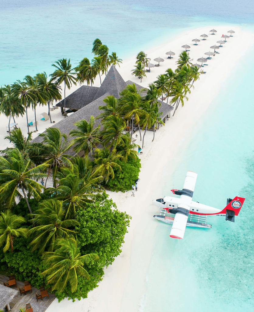 Plane parked on a beautiful island - Utopian Adventures